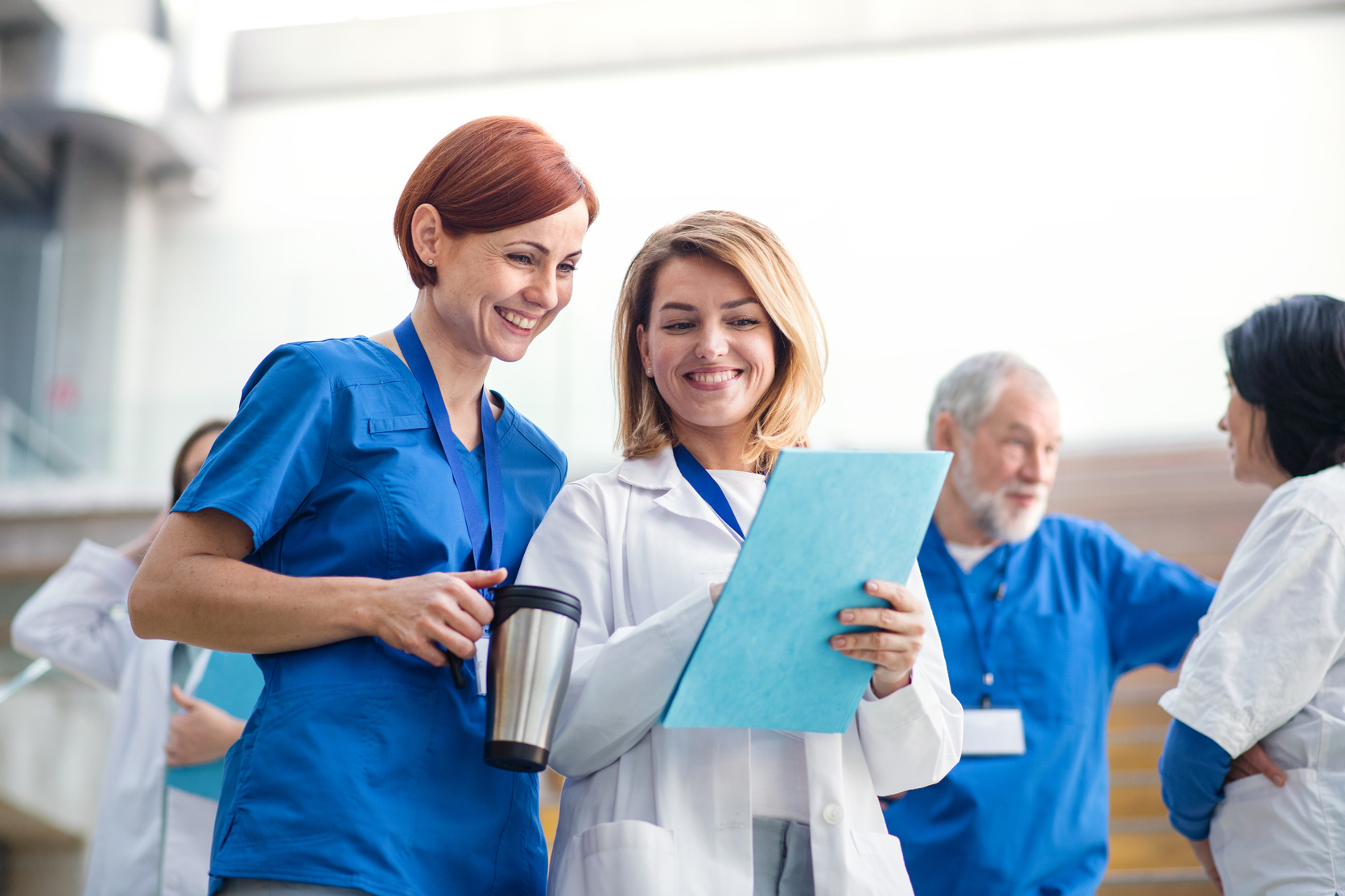  Doctors Discussing Documents while on Medical Conference